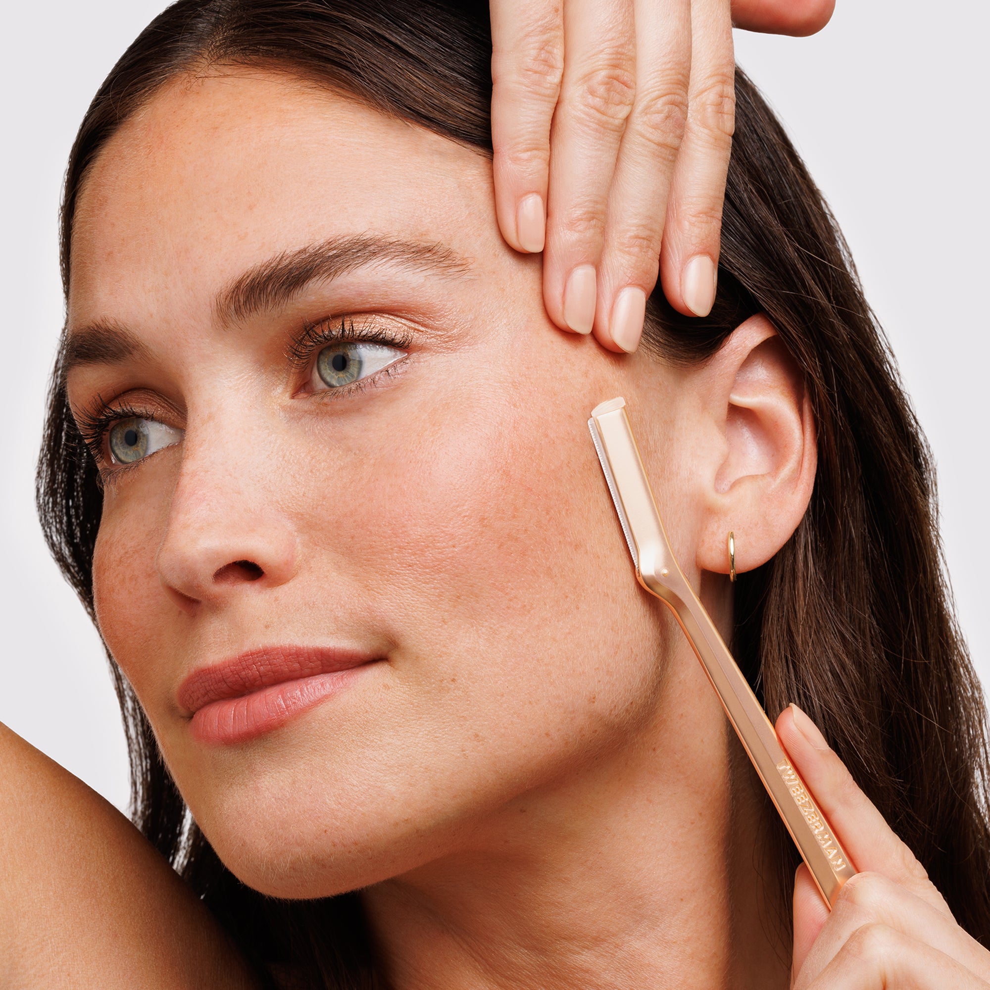 MODEL USING ROSE GOLD FACIAL RAZOR
